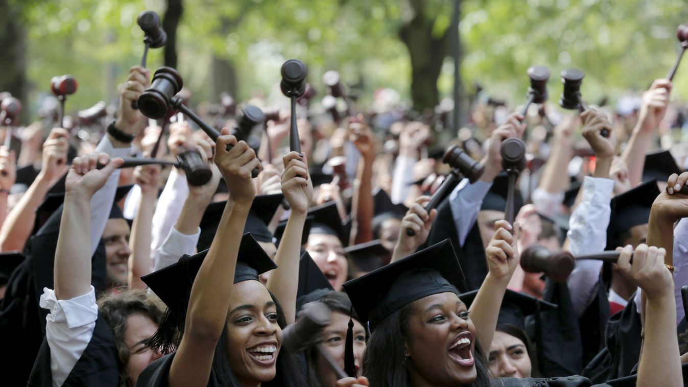 Students graduating from the School of Law cheer as they receive their degrees during the 364th Commencement Exercises at Harvard University in Cambridge