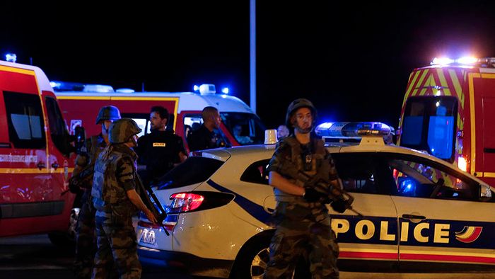 French soldiers and rescue forces are seen at the scene whare at least 30 people were killed in Nice when a truck ran into a crowd celebrating the Bastille Day national holiday