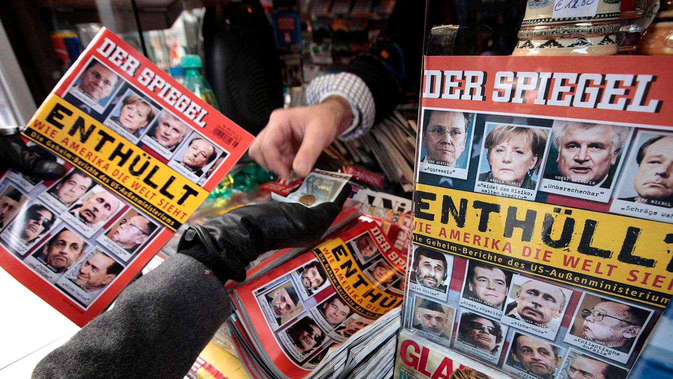 A customer buys the German Der Spiegel magazine at a kiosk in Hamburg