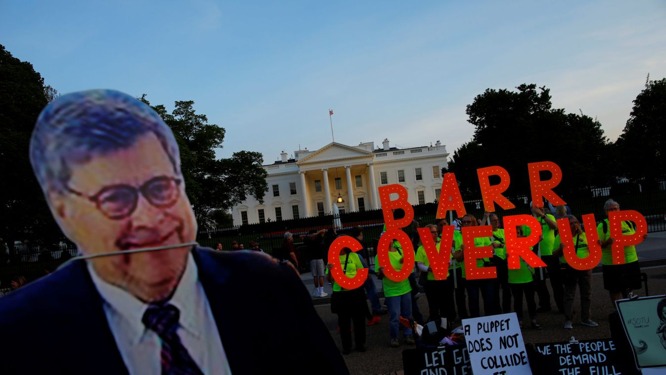 A cardboard cutout of U.S. Attorney General Barr is seen as protesters hold signs following the release of the Mueller report on U.S. President Trump at in Washington