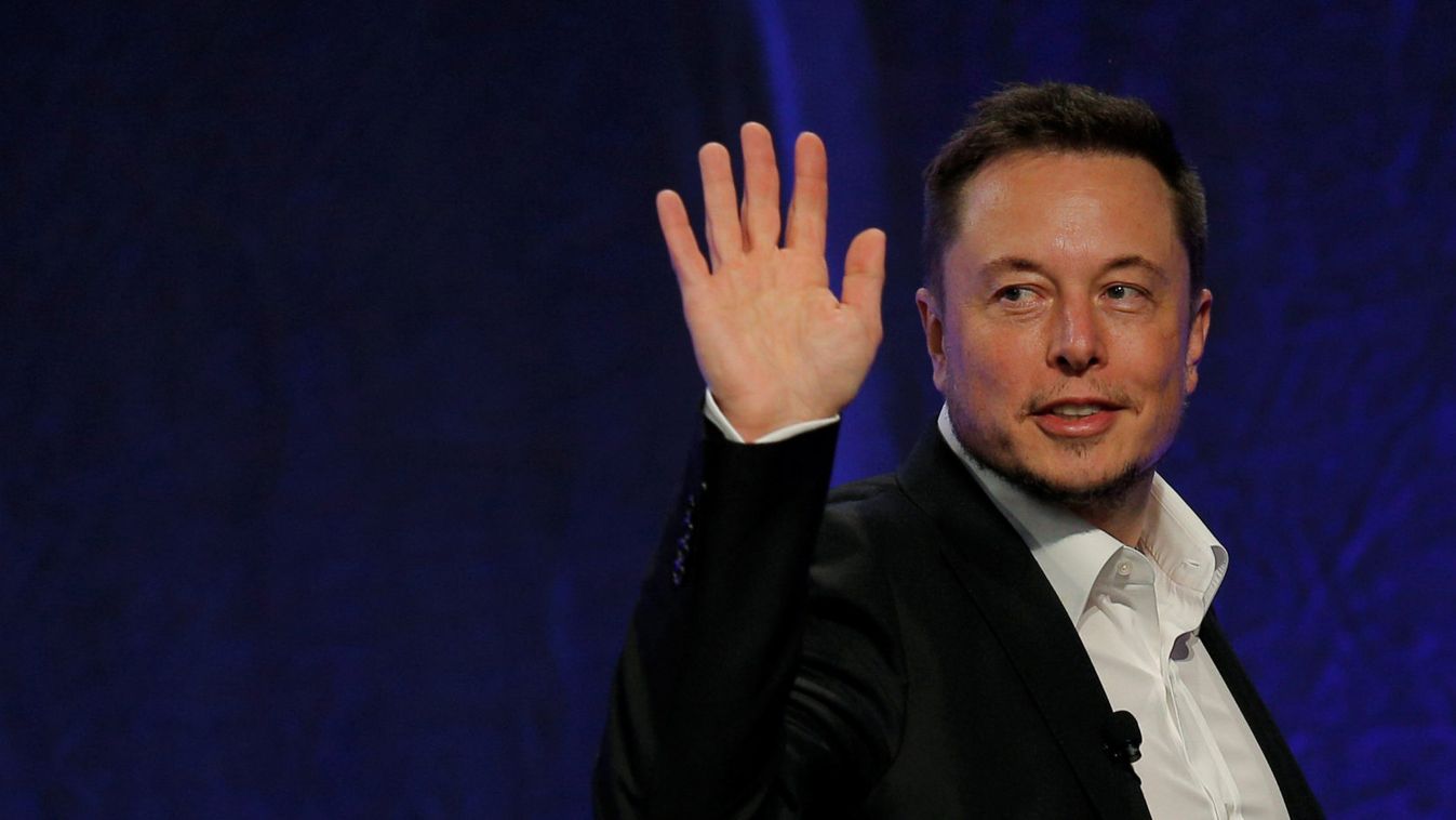 Tesla Motors CEO Elon Musk waves as he leaves the stage after speaking at the National Governors Association Summer Meeting in Providence