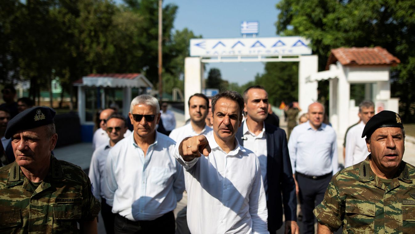 Main opposition New Democracy conservative party leader Kyriakos Mitsotakis makes his way on a bridge connecting Greece and Turkey, near the village of Kastanies