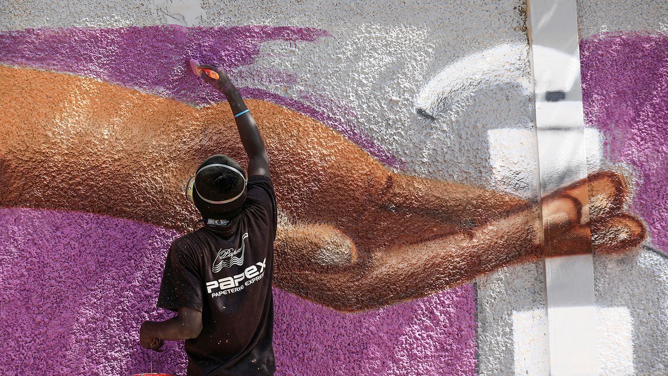 A graffiti artist from RBS crew works on his mural to encourage people to protect themselves amid the outbreak of the coronavirus disease (COVID-19), in Dakar