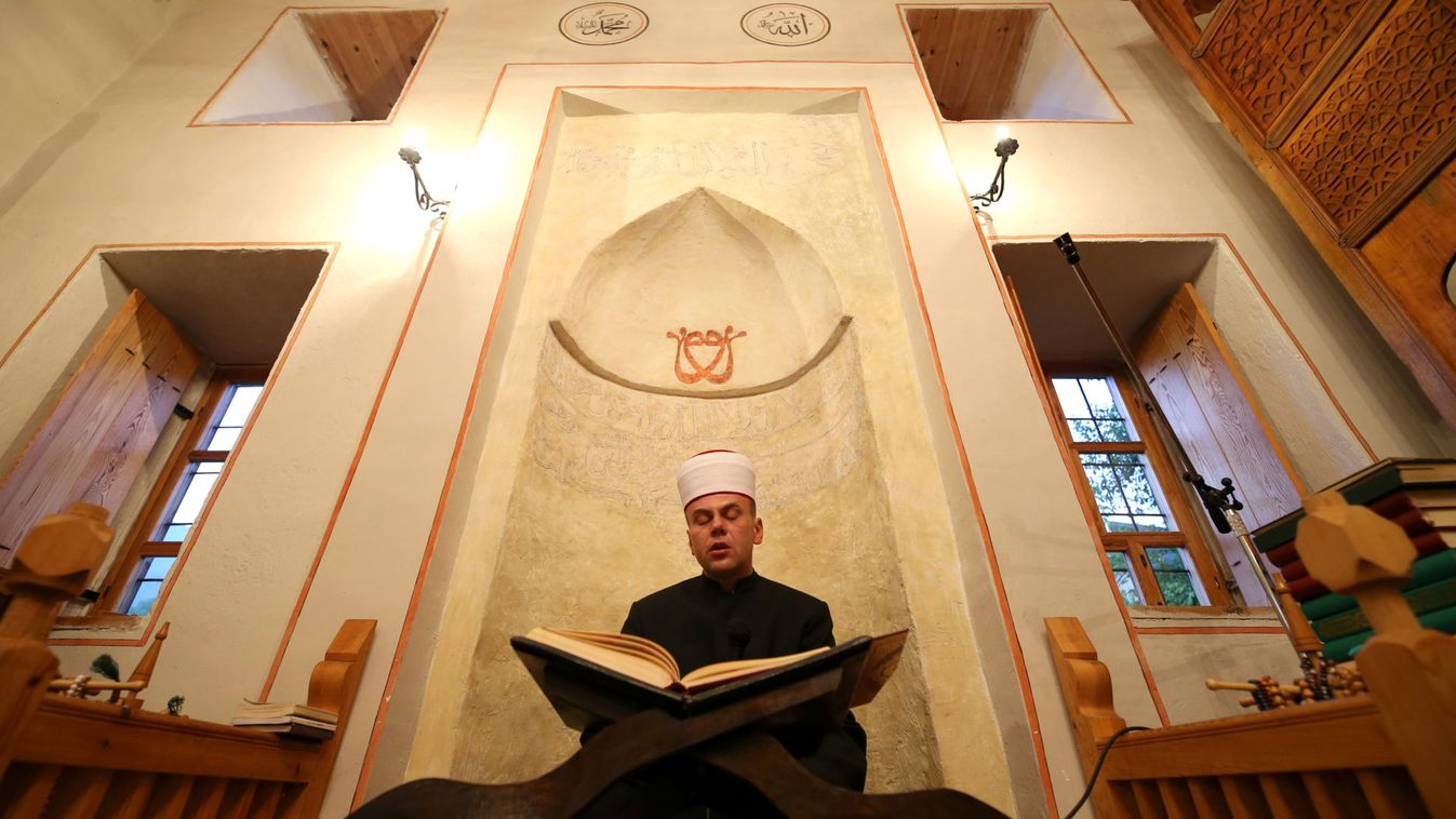 Bosnian Muslim Imam leads a prayer during the Muslim festival Eid al-Adha at a mosque in Kraljeva Sutjeska