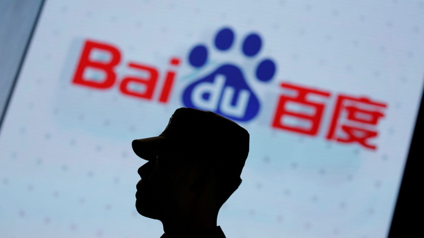 A security personnel stands guard at the opening session of Baidu's annual AI developers conference in Beijing