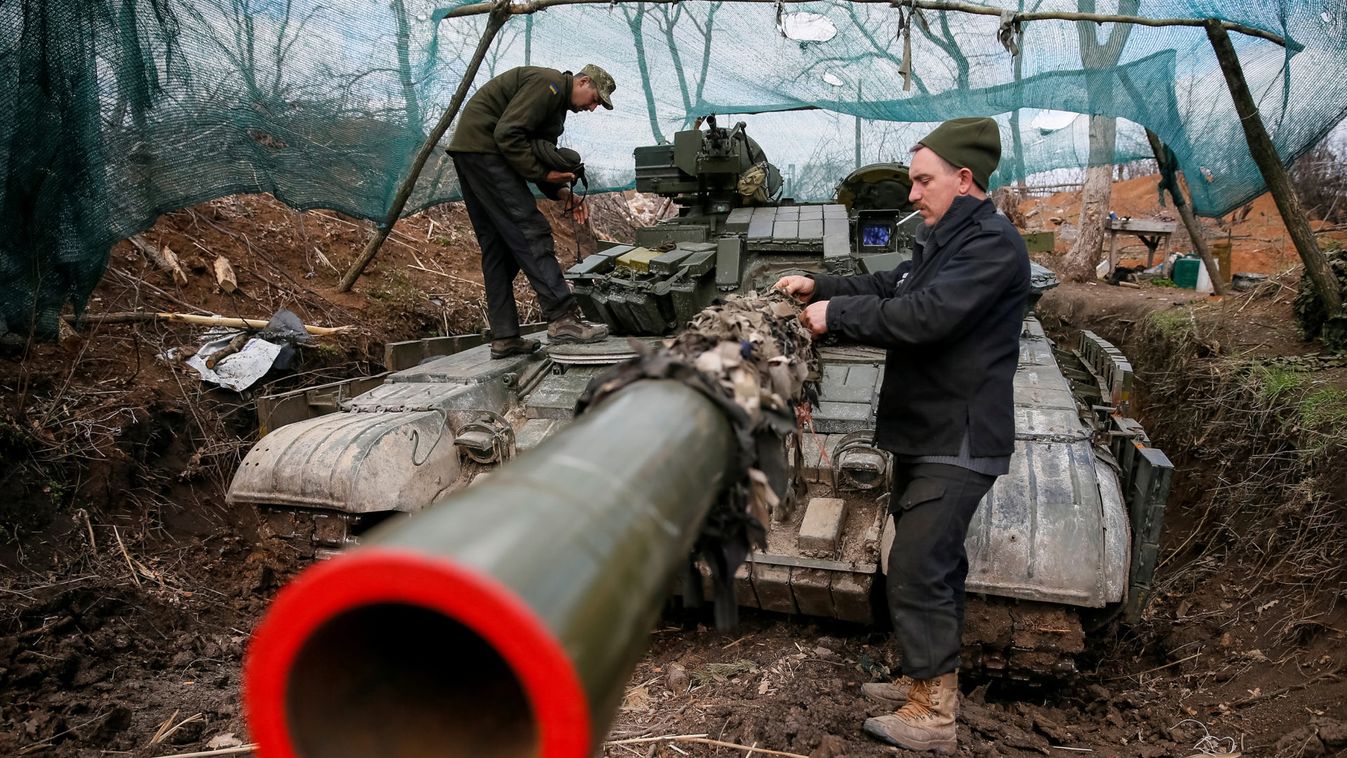 Ukrainian servicemen check and repair their tank in Donetsk Region