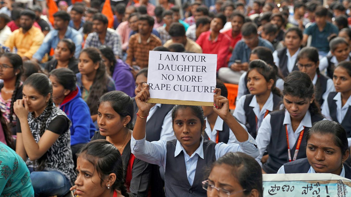A woman holds a placard during a protest against the alleged rape and murder of a 27-year-old woman in Hyderabad