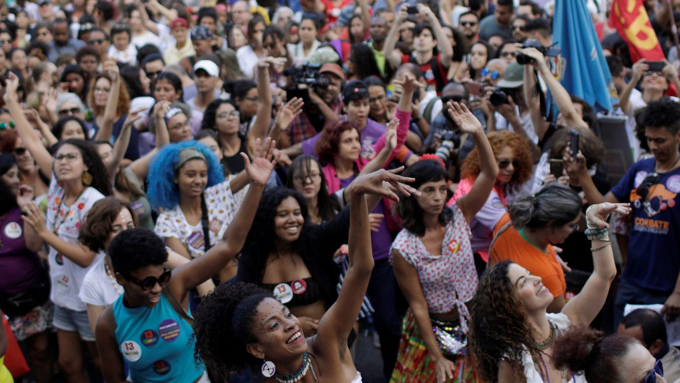 Women dance during a protest against presidential candidate Jair Bolsonaro in Rio de Janeiro