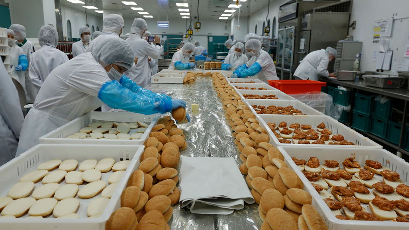 Workers prepares sandwiches inside Cathay Pacific Airway's inflight kitchen near Hong Kong Airport