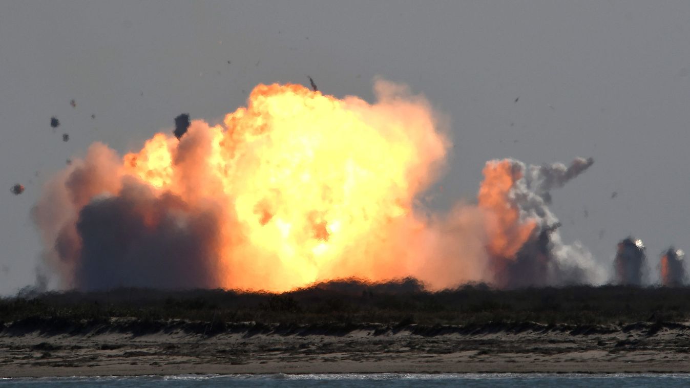 The SpaceX Starship SN9 explodes into a fireball after its high altitude test flight from test facilities in Boca Chica