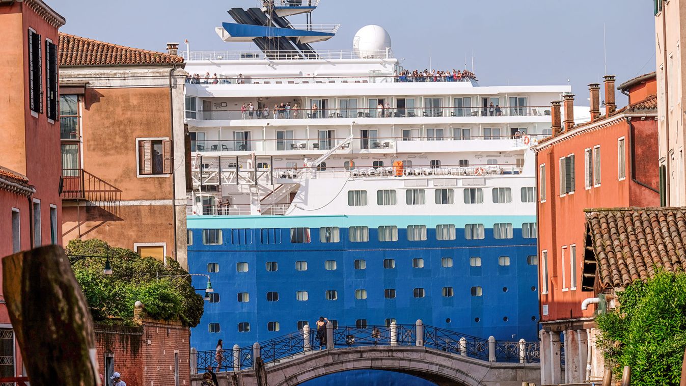 A cruise ship enters the lagoon crossing the Giudecca Canal on the day of the protest "No grandi navi - No big ships" in Venice