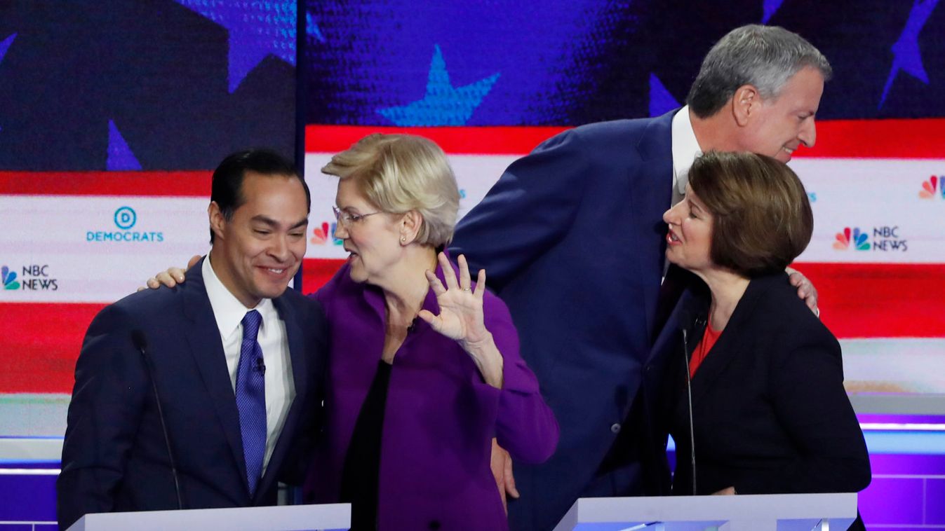 Candidates talk at the conclusion of the first U.S. 2020 presidential election Democratic candidates debate in Miami, Florida, U.S.