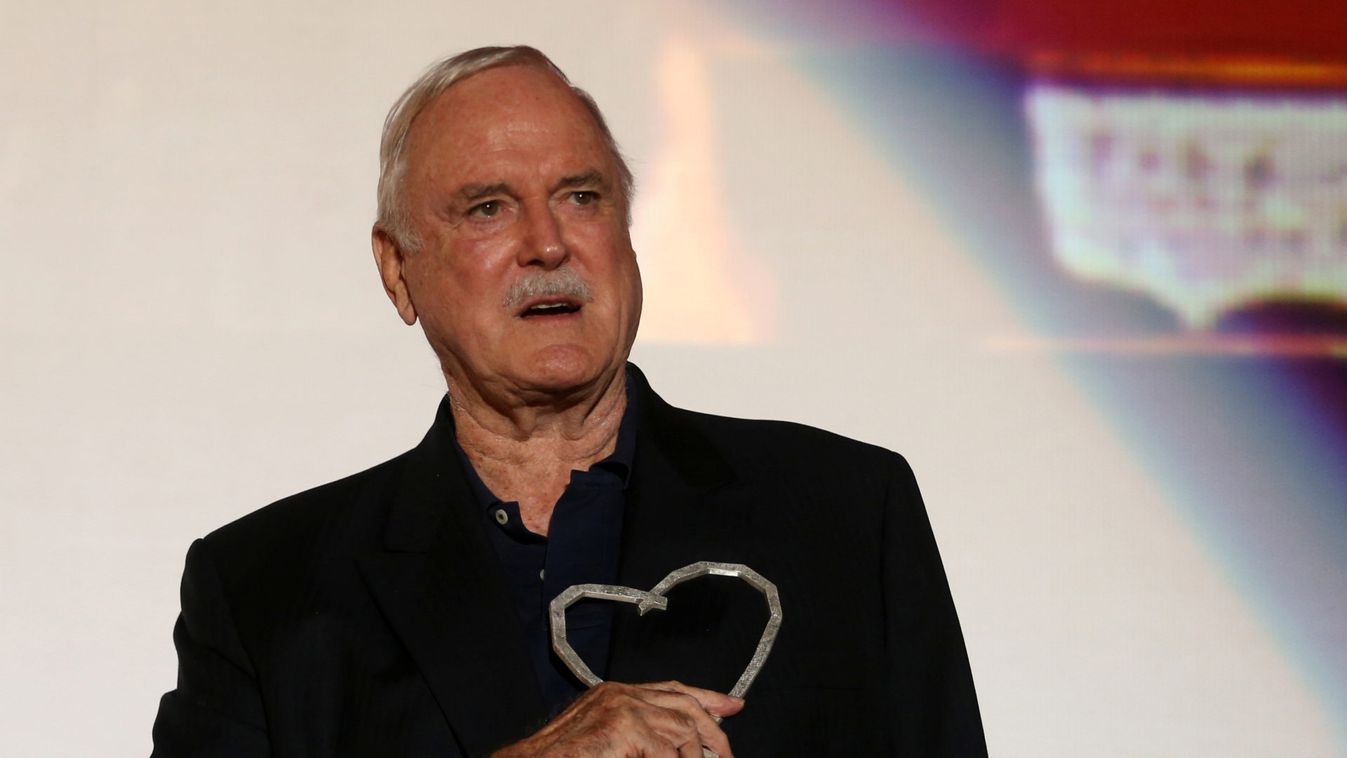 British actor John Cleese poses with the Heart of Sarajevo honorary award during the 23rd Sarajevo Film Festival in Sarajevo