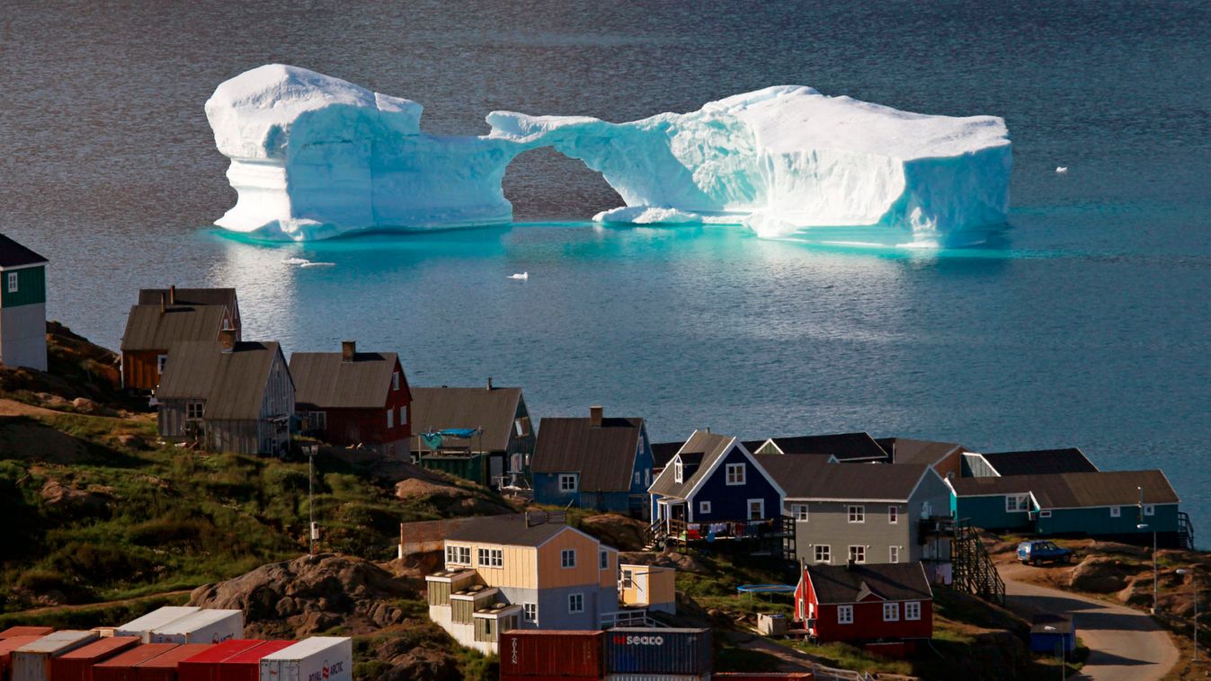 An iceberg floats near a harbour in the town of Kulusuk, east Greenland