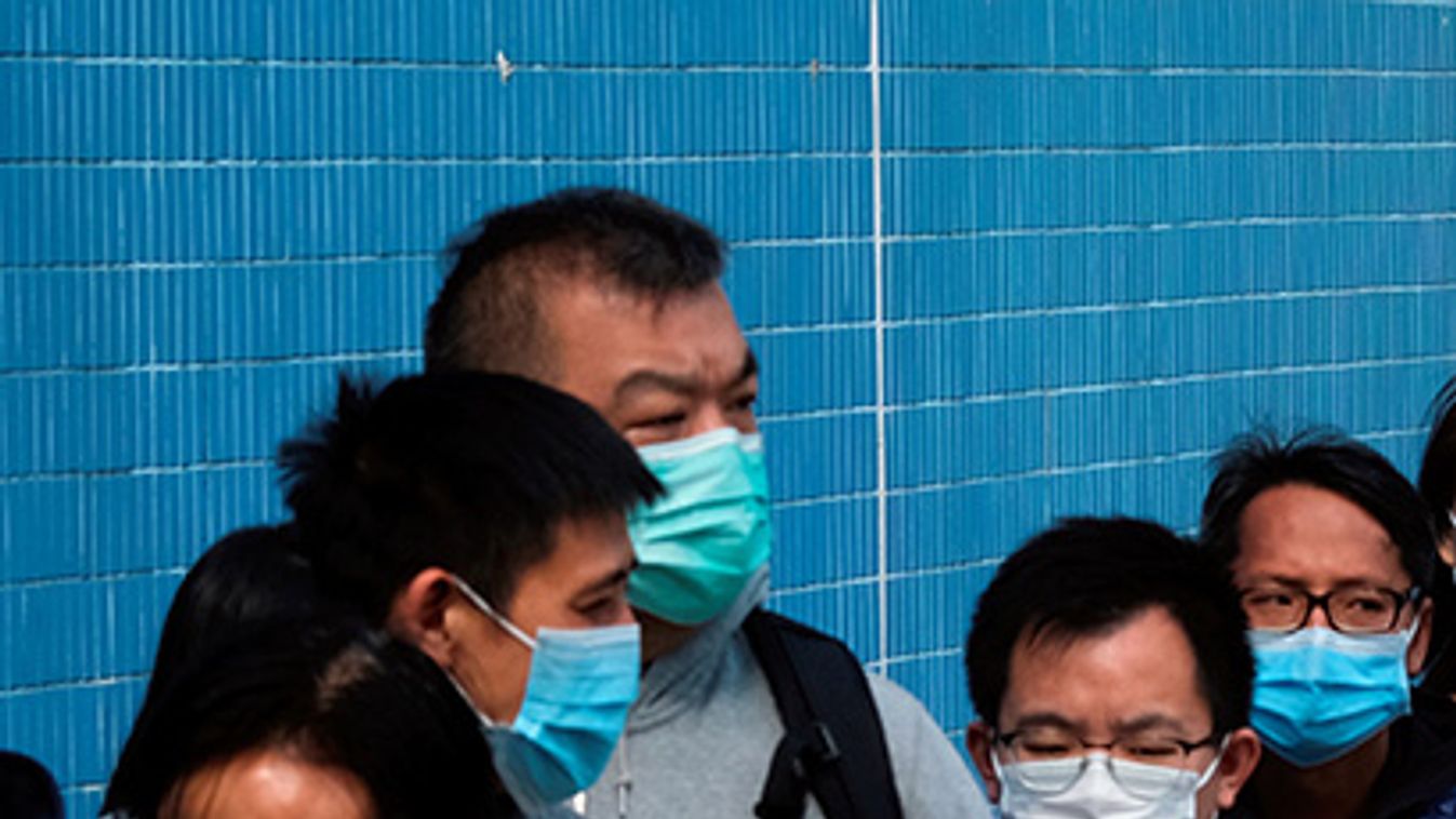 Customers queue to buy facial masks to prevent an outbreak of a new coronavirus, in Hong Kong