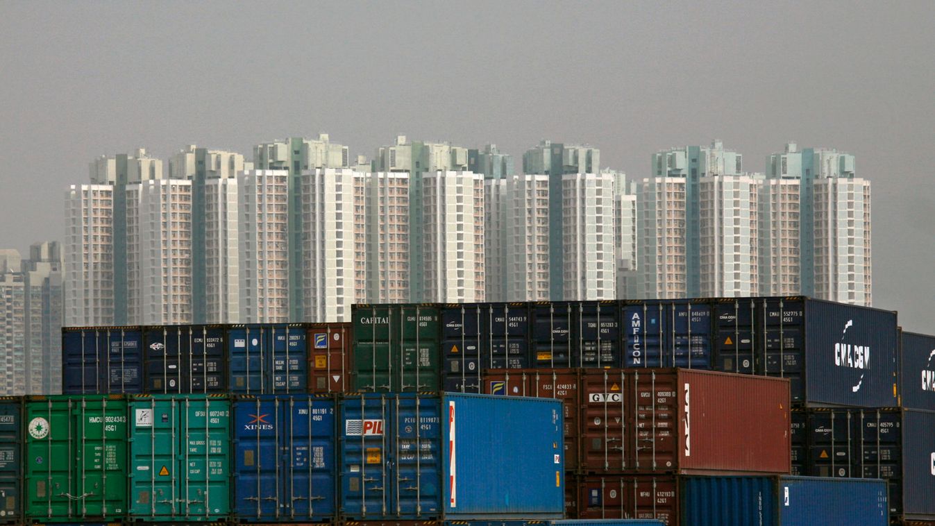 Unused shipping containers are piled up at a storage depot near a housing estate in north-west Hong Kong