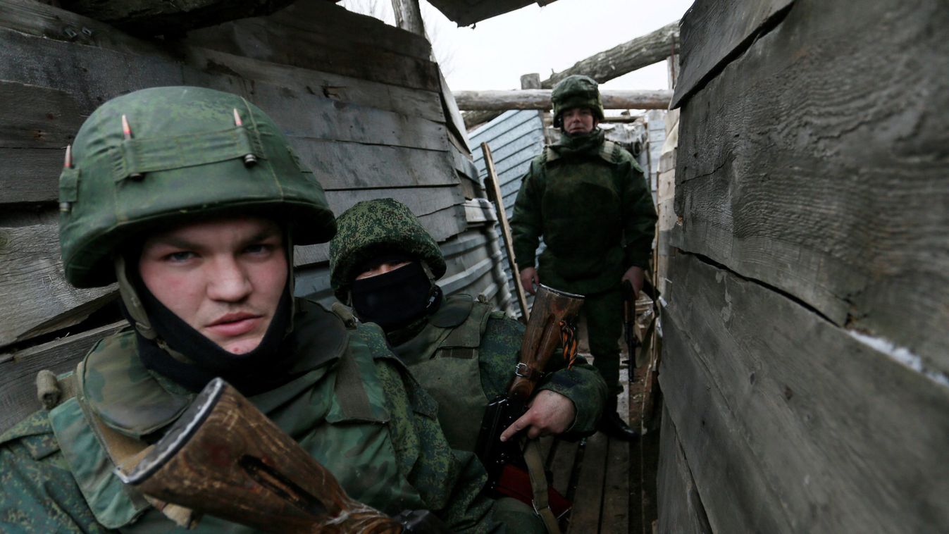 Militants of the self-proclaimed Donetsk People's Republic stand guard on the separation line near Staromykhailivka