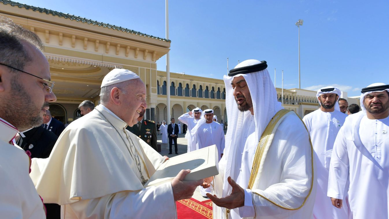 Pope Francis talks with Abu Dhabi's Crown Prince Mohammed bin Zayed Al-Nahyan during a farewell ceremony before leaving Abu Dhabi