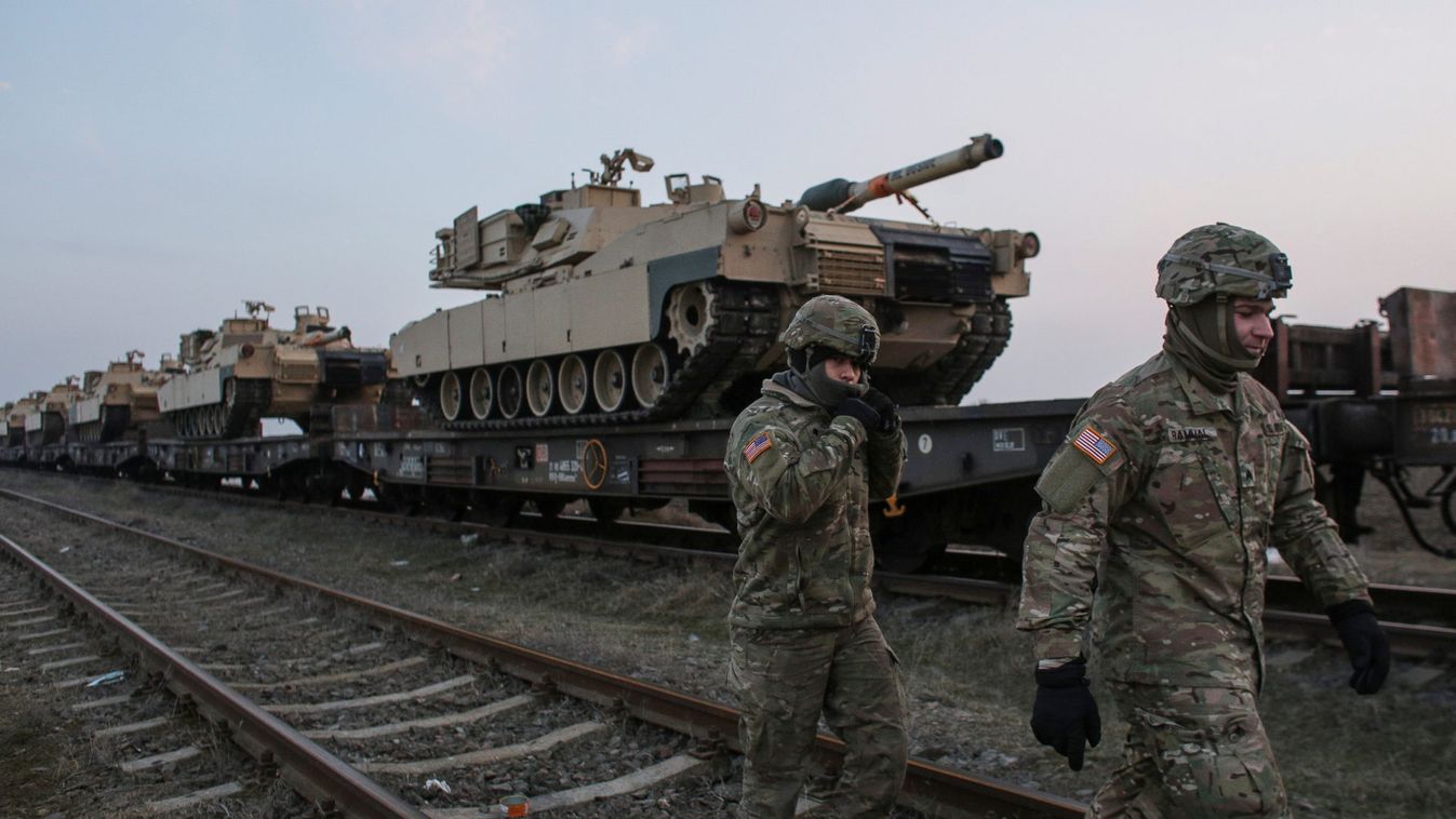 US soldiers walk next to M1 Abrams tanks at the Mihail Kogalniceanu Air Base