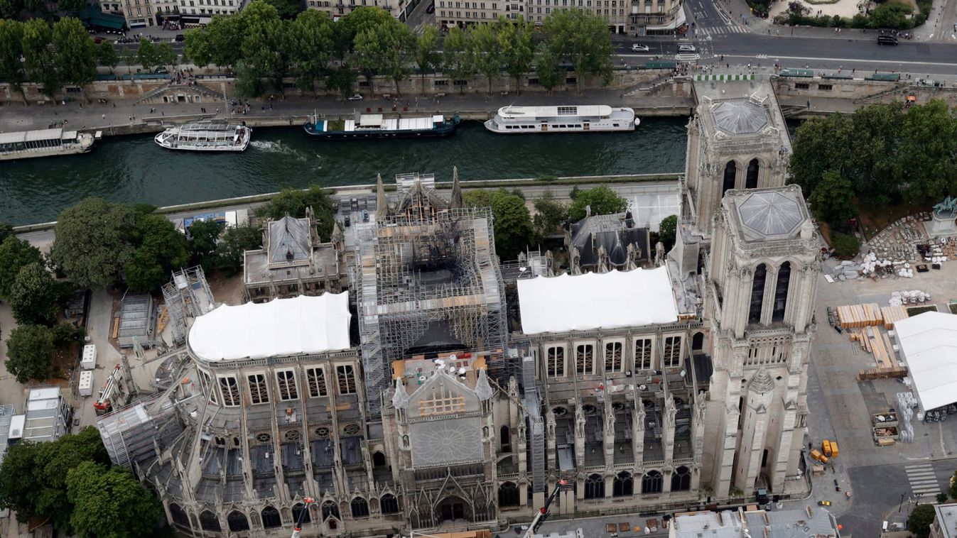 A view shows the damaged roof of Notre-Dame de Paris during restoration work, three months after a fire that devastated the cathedral in Paris