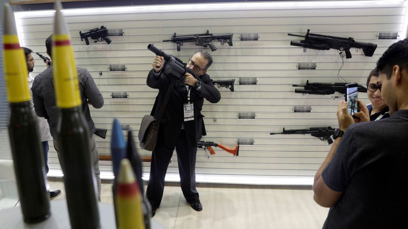 A man holds a gun during LAAD, the biggest military industry expo in Latin America in Rio de Janeiro