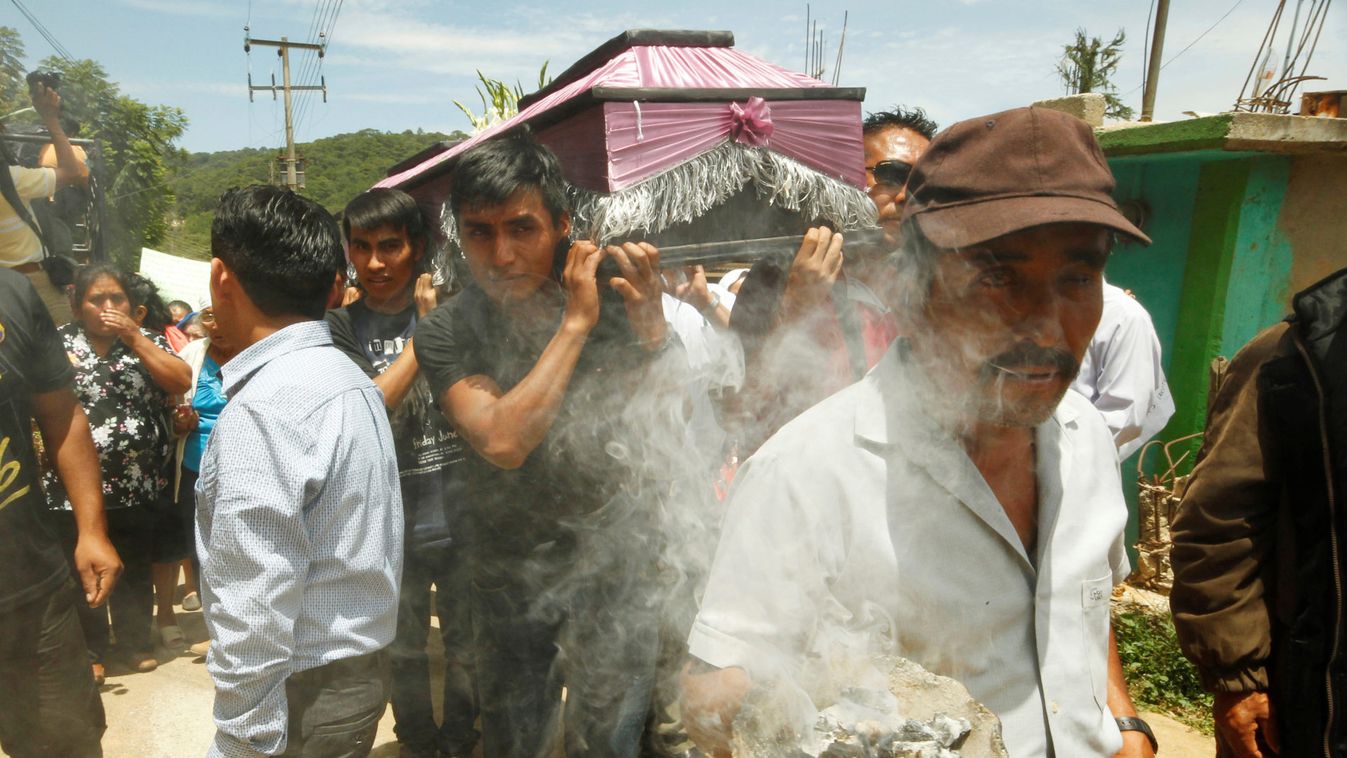 Relatives take part in the funeral of 13 people who were killed by residents from the San Lucas Ixcotepec community over a reported decades-long land dispute, in Santa Maria Ecatepec, Oaxaca