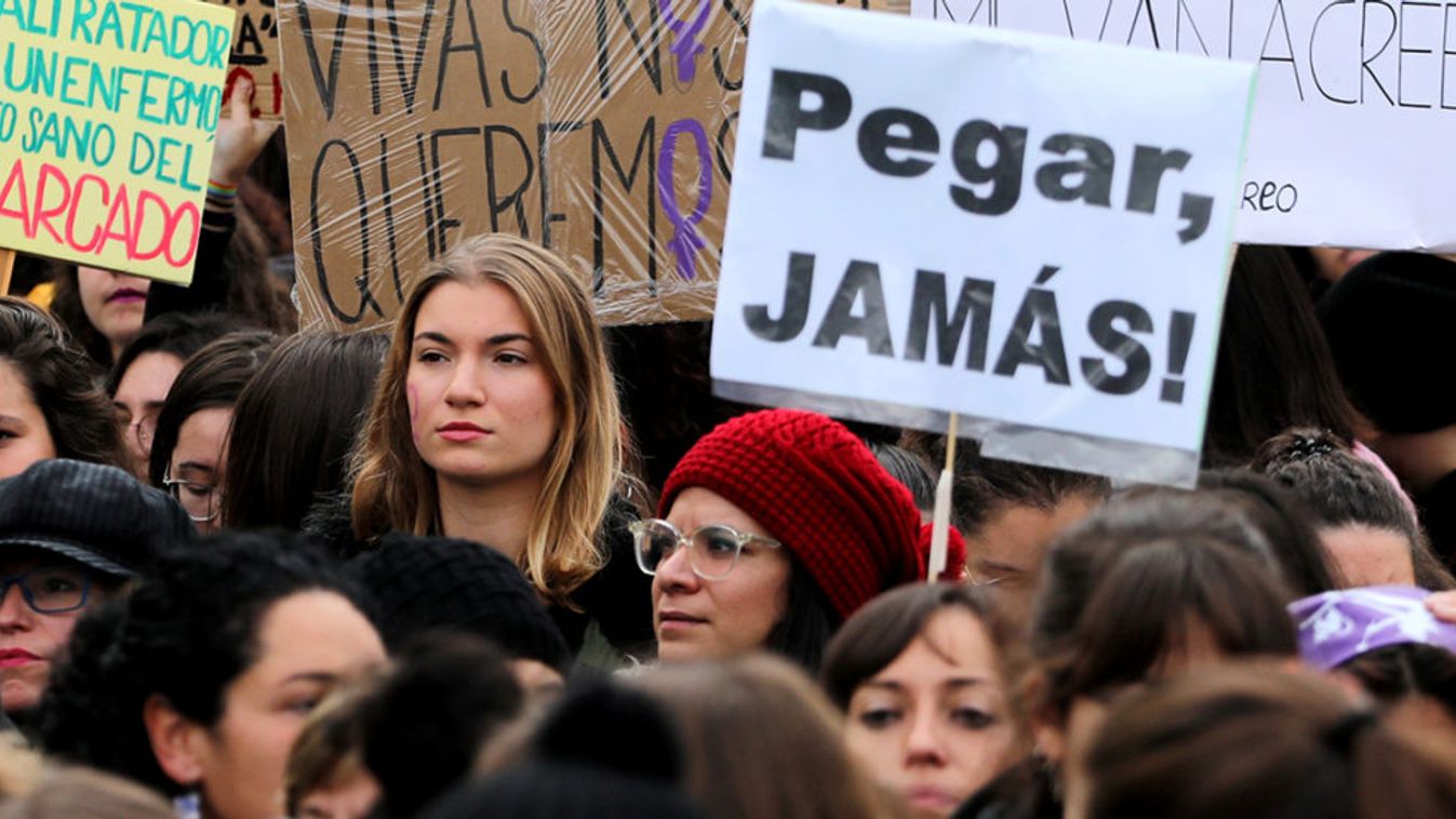 People attend a rally against gender-based and sexual violence against women in Madrid