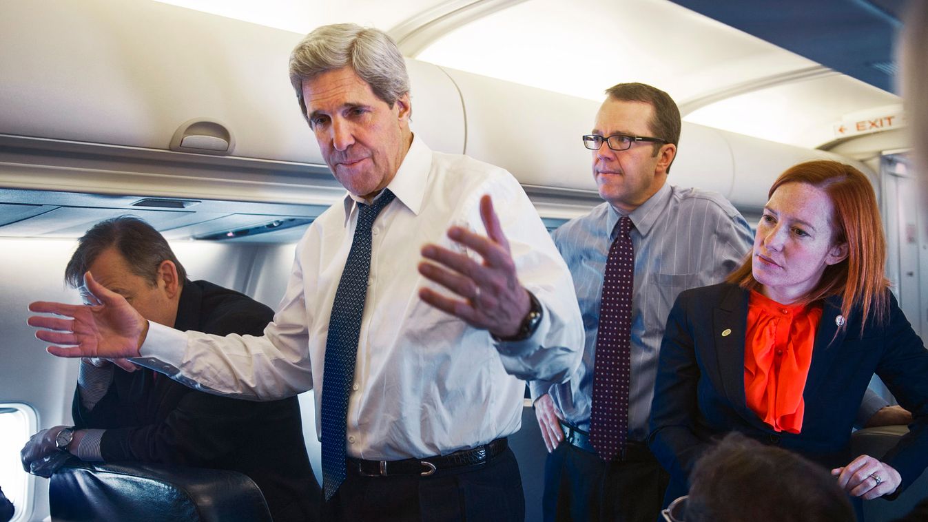 US Secretary of State Kerry talks with reporters aboard his government aircraft shortly after departing Seoul Air Base for Beijing
