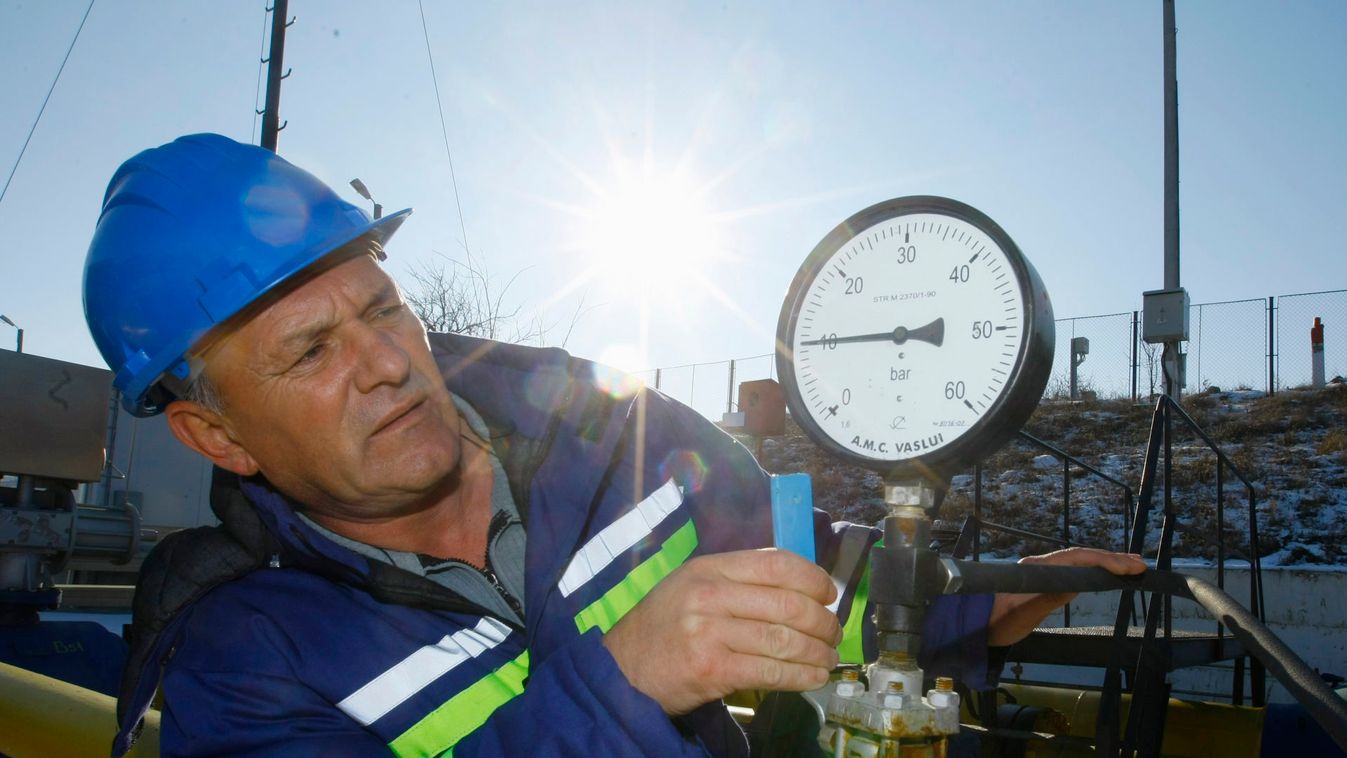 Baciu, a Transgaz operator, checks a pressure gauge at the main gas distribution station where pipelines enter Romania from Ukraine in Isaccea