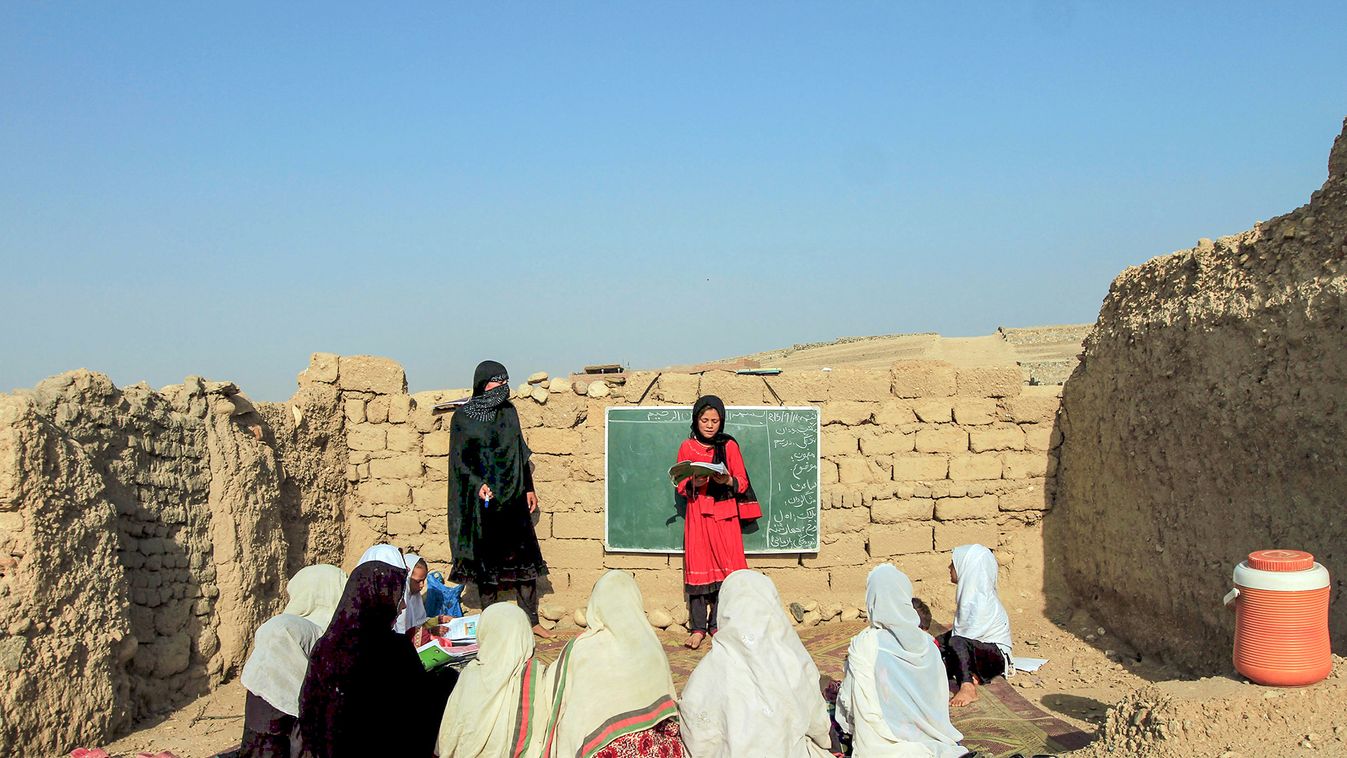 Afghan girls study at an open area, founded by Bangladesh Rural Advancement Committee (BRAC), outside Jalalabad city
