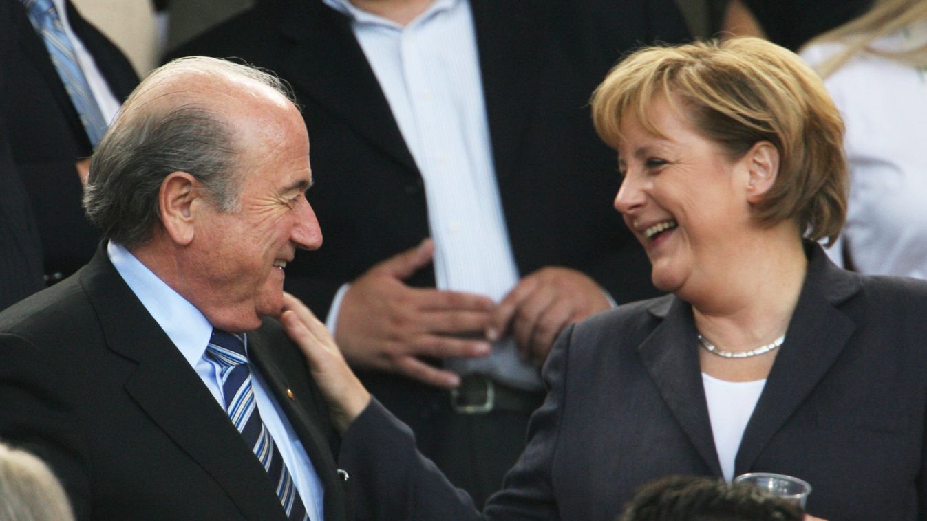 FIFA President Sepp Blatter talks to German Chancellor Angela Merkel before the start of the World Cup 2006 third place soccer match between Germany and Portugal in Stuttgart
