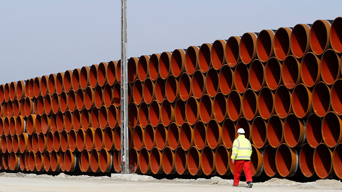Worker walks along pipes for Nord Stream pipeline at storage in Mukran on the Baltic island of Ruegen
