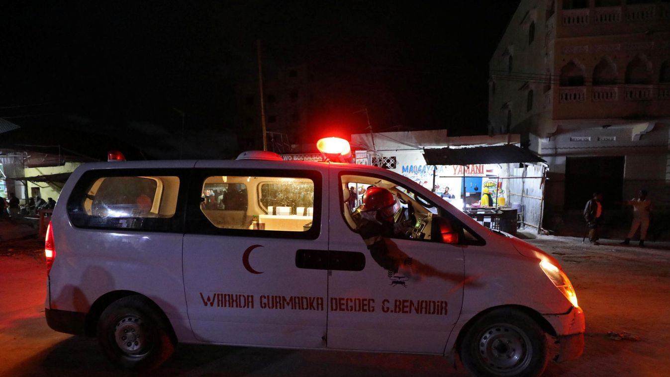 An ambulance drives from the scene of a blast at the Elite Hotel in Lido beach in Mogadishu