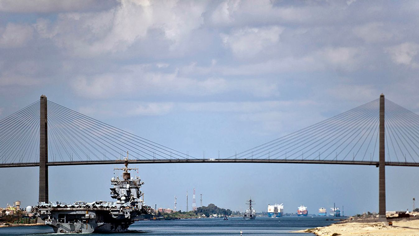 The aircraft carrier USS Enterprise (CVN 65) crosses under the Friendship Bridge in the Suez Canal for the final time