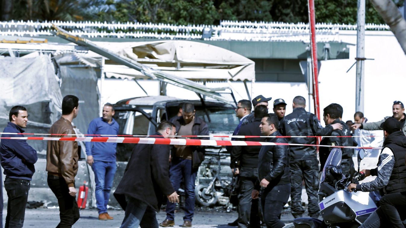 People gather at the site of a suicide attack near the U.S. embassy in Tunis