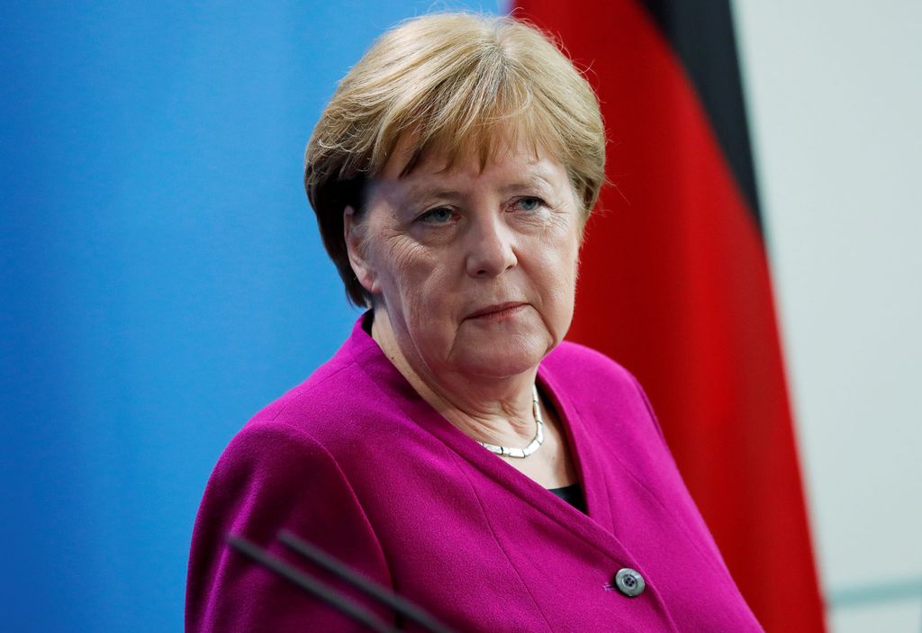 German Chancellor Merkel looks on as she attends a news conference at the Chancellery in Berlin