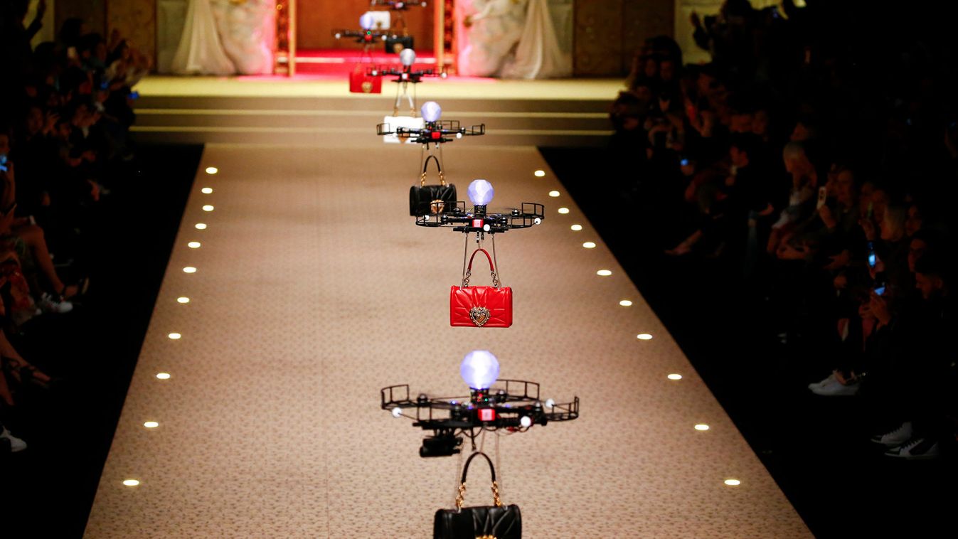 Drones carry bags, the creations from the Dolce & Gabbana Autumn/Winter 2018 women's collection during Milan Fashion Week in Milan