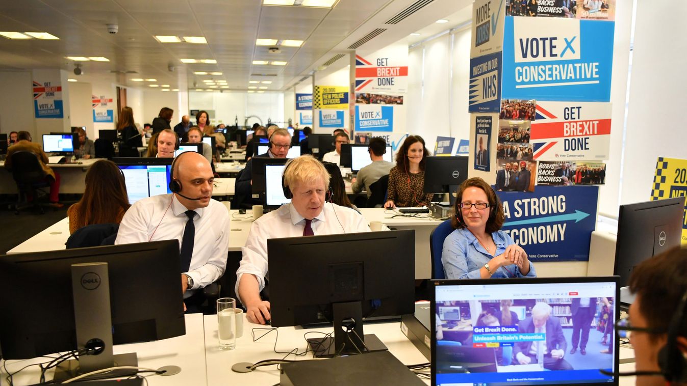 Britain's Chancellor of the Exchequer Sajid Javid and Britain's Prime Minister Boris Johnson and Britain's Leader of the House of Lords Natalie Evans speak to a callers at the Conservative Campaign Headquarters Call Centre in central London