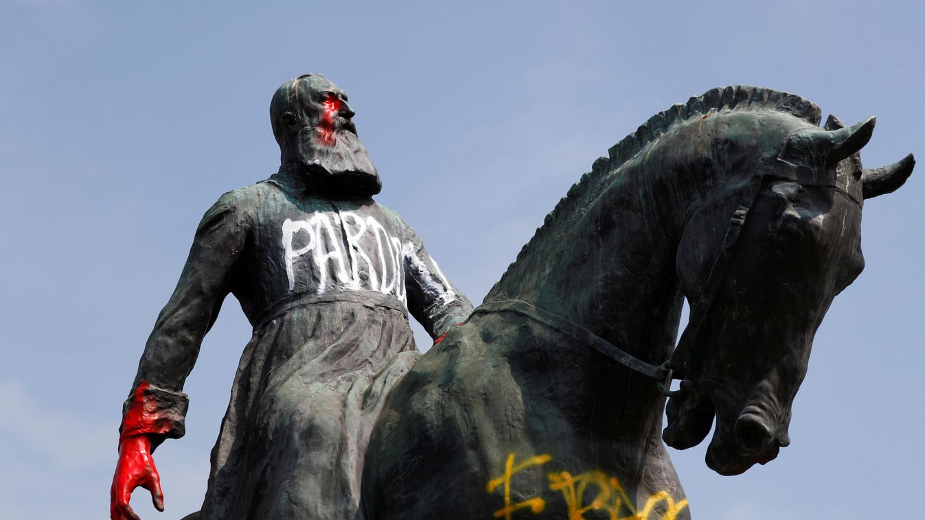Graffitis are seen on a statue of former Belgian King Leopold II near Brussels' Royal Palace