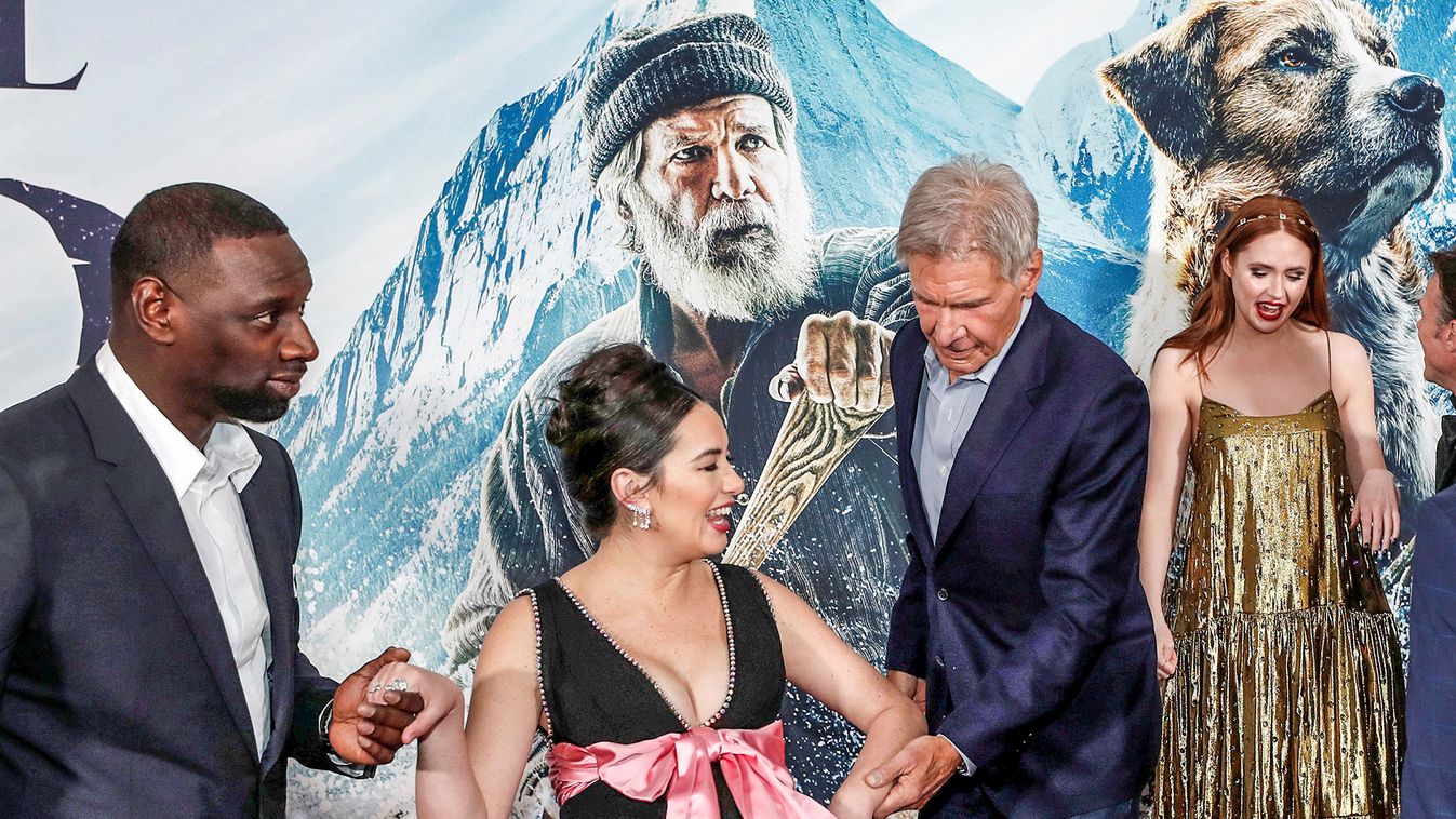 Cast members Sy and Ford help co-star Gee at the premiere of "The Call of the Wild" in Los Angeles