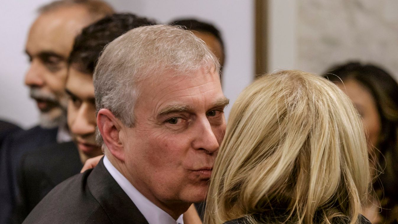 Britain's Prince Andrew greets a business leader during a reception at the sideline of the World Economic Forum in Davos