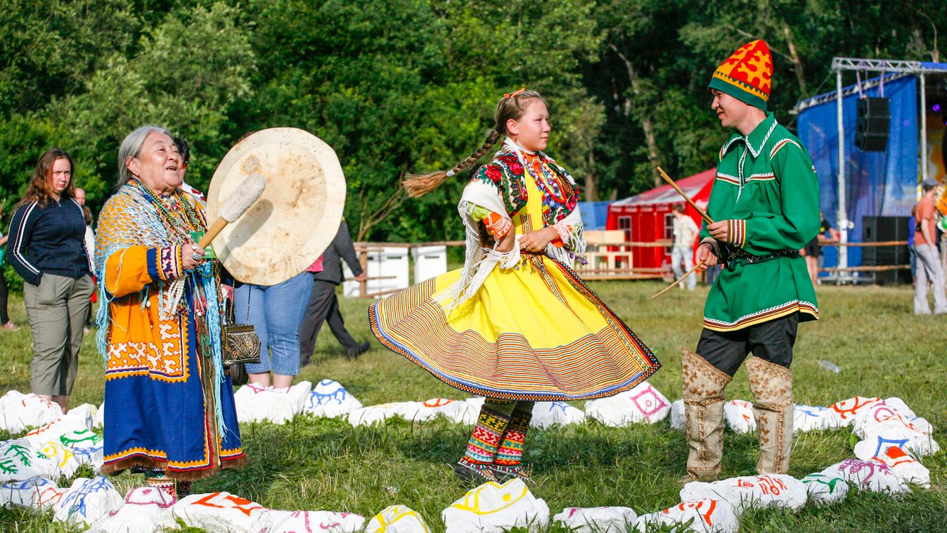 Ethnic folk trio "Yeshak Nay" representing Khanty, consisting of Maria Vomdina, Ksenia Grebennikova and Vitaly Bank, perform at the 8th international ethnic festival "Sayan Ring" near the village of Shushenskoye