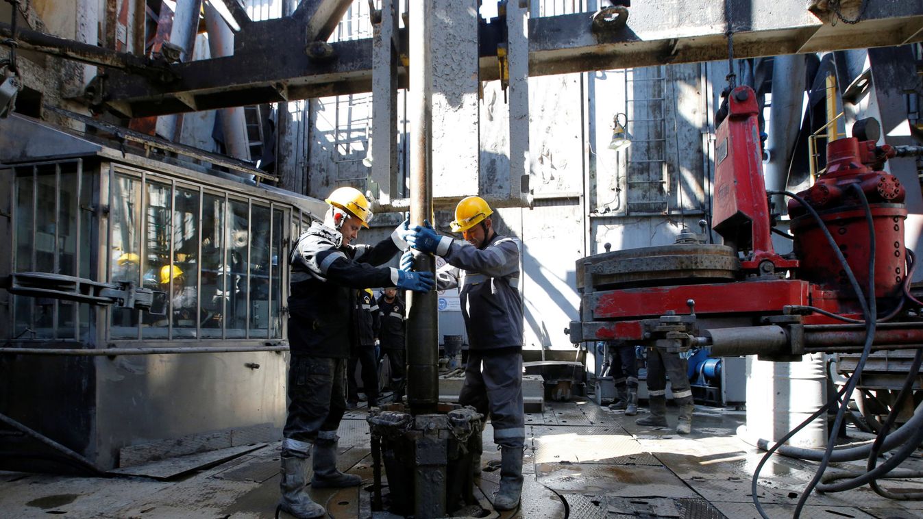 Employees work on drilling rig at Rosneft-owned Prirazlomnoye oil field outside Nefteyugansk