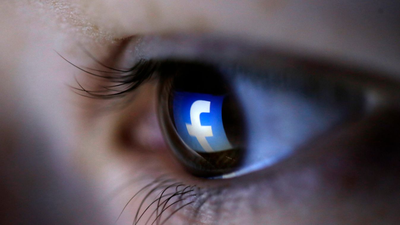 A picture illustration shows a Facebook logo reflected in a person's eye, in Zenica