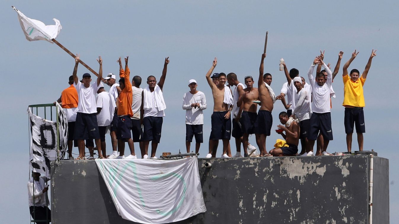 Inmates at Puraquequara's prison are seen on the roof during a riot following an outbreak of the coronavirus disease (COVID-19), in Manuas