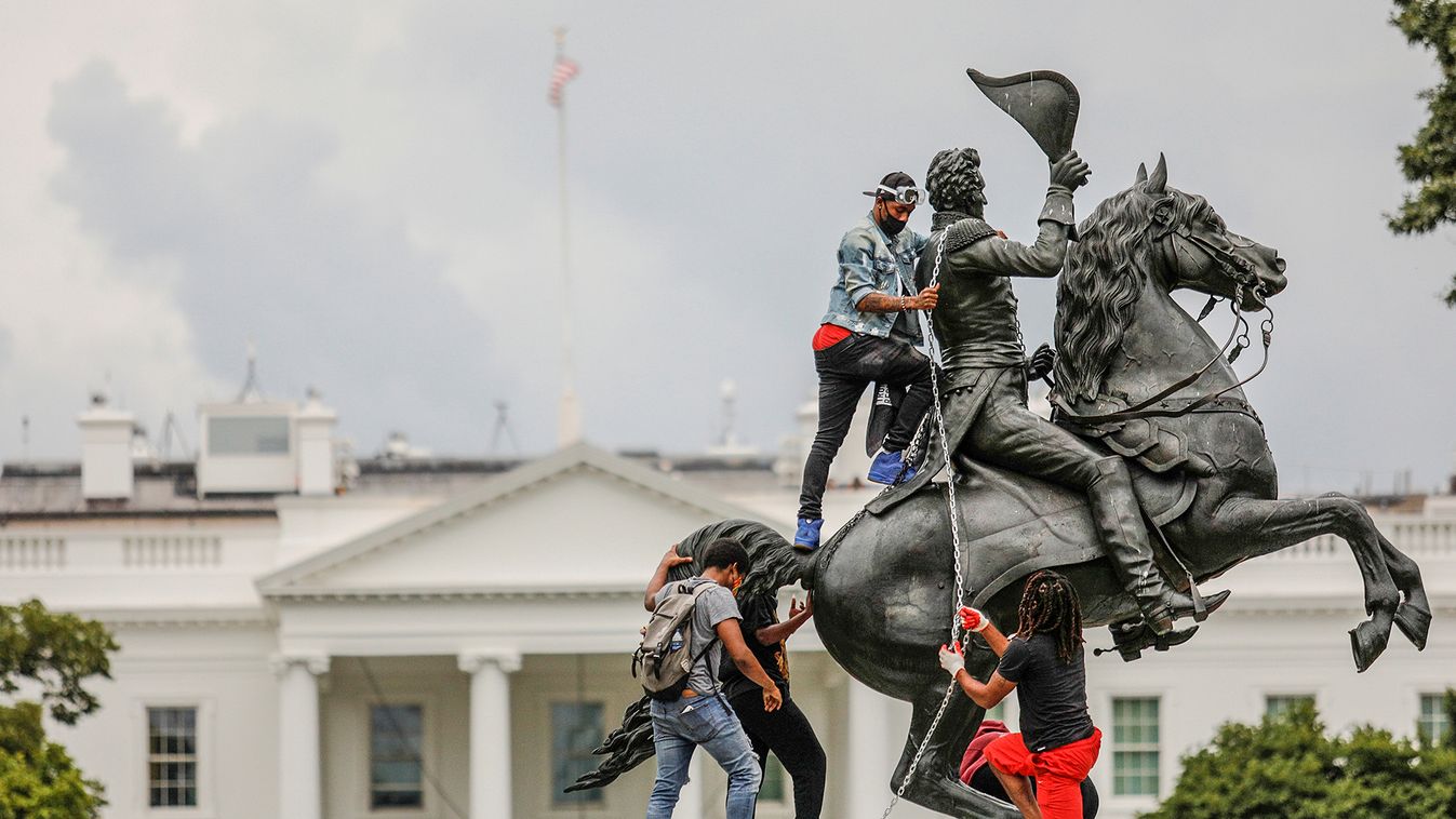 Protestors attach a chain to the statue of U.S. President Andrew Jackson in front of the White House in an attempt to pull it down during racial inequality protests in Washington