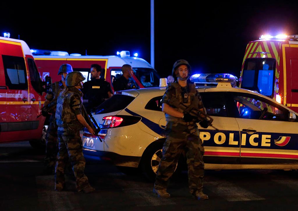 French soldiers and rescue forces are seen at the scene whare at least 30 people were killed in Nice when a truck ran into a crowd celebrating the Bastille Day national holiday