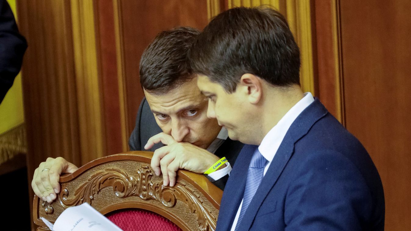 Ukrainian President Zelenskiy listens to Razumkov, newly-appointed Parliamentary Speaker, during the first session of new parliament in Kiev