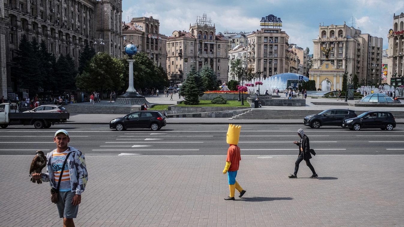 People walk at the Independence Square in central Kiev