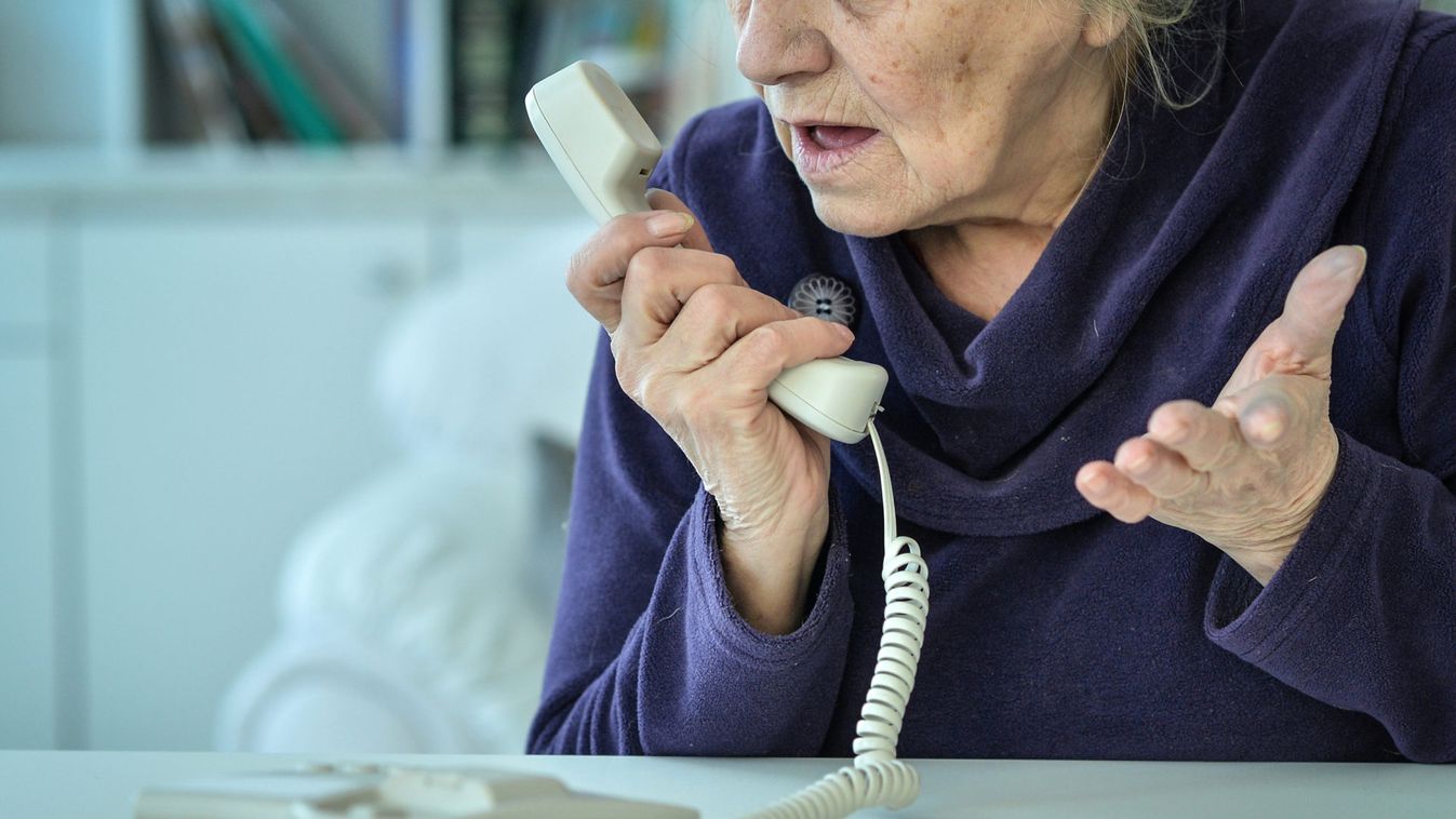 Sick mature woman calling doctor